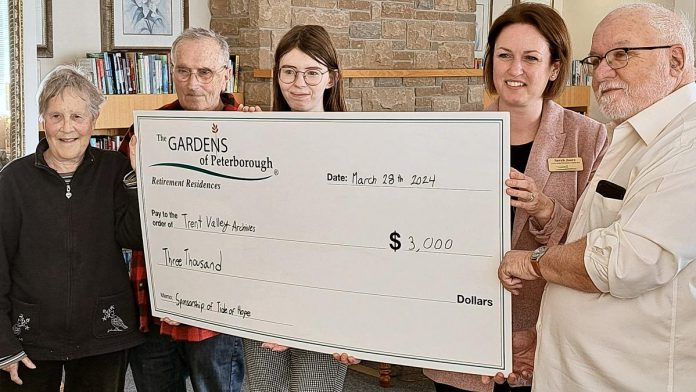 Sarah Joore of The Gardens of Peterborough Retirement Residence (second from right) presented a $3,000 sponsorship cheque to Trent Valley Archives board of directors president Steve Guthrie (right) on March 28, 2024 in support of Trent Valley Archives Theatre's inaugural history play "Tide of Hope" to be performed in May. Also pictured from left to right are Trent Valley Archives Theatre co-producers Mary and Greg Conchelos and Trent Valley Archives board vice-president Madison More. (Photo: Edward Schroeter)