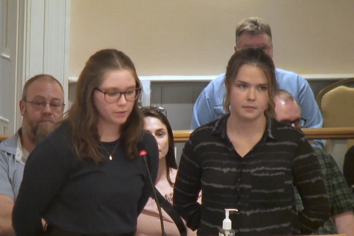Suzanne Mooser (left) and Emily Wakeham, two students at Fleming College's Frost campus in Lindsay, appeared before Kawartha Lakes city council on May 7, 2024 asking that council consider and pass a resolution calling for the college's reversal of the suspension of the programs. Wakeham made the presentation and both she and Mooser answered questions posed by councillors. (kawarthaNOW screenshot of City of Kawartha Lakes video)
