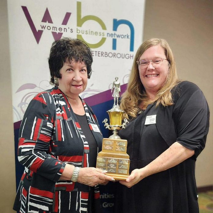 Maureen Tavener (left) awards Ashley Bonner with the 2024 Member of the Year Award from the Women's Business Network of Peterborough. A resident of East City, Bonner is the small business owner of Smarketing, the organizer of the East City Neighbourhood Yard Sale, and the founder of the forthcoming neighbourhood app called Community Pin. (Photo: Women's Business Network of Peterborough)