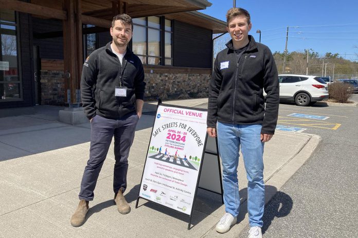 Luke Parsons and Ethan Taylor from Engage Engineering proudly represented their employer at the 2024 Peterborough & the Kawarthas Cycling Summit: Safe Streets for Everyone on April 25, 2024. A Green Economy Peterborough member, Engage was an event sponsor and is a bike-friendly employer. (Photo: Jackie Donaldson)