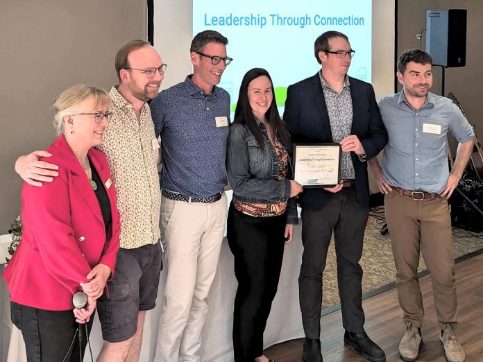 Engage Engineering received the "Leadership Through Connection" award at Green Economy Peterborough's third annual Leadership in Sustainability Awards on May 16, 2024. Pictured from left to right are Jackie Donaldson, Dylan Radcliffe, Paul Hurley, Nicole Cameron, Joel Wiebe, and Luke Parsons. (Photo: Tegan Moss / GreenUP)