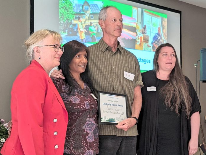 Lake Edge Cottages received the "Leadership Outside of the Box" award at Green Economy Peterborough's third annual Leadership in Sustainability Awards on May 16, 2024. Pictured from left to right are Jackie Donaldson, Anne and Steve Wildfong, and Breanna Guiotto of Selwyn Township. (Photo: Tegan Moss / GreenUP)