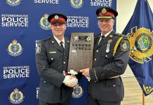 Constable Dan Mundell (left, pictured with Peterborough Police Chief Stuart Betts) received the Carol Winter Humanitarian Award, recognizing a member of the police service who has contributed to the needs of vulnerable people in the community, during the 46th Annual Knights of Columbus Police Appreciation Night on May 15, 2024. (Photo: Peterborough Police Service)