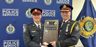 Constable Dan Mundell (left, pictured with Peterborough Police Chief Stuart Betts) received the Carol Winter Humanitarian Award, recognizing a member of the police service who has contributed to the needs of vulnerable people in the community, during the 46th Annual Knights of Columbus Police Appreciation Night on May 15, 2024. (Photo: Peterborough Police Service)