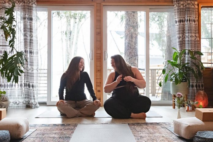 Body-neutral yoga guide Breanna Guiotto (right) is teaming up with Laura Dunford of Peterborough's Sweet Flowering Yoga & Wellness (left) for the Balance and Align Day Retreat at Sarovara Yoga in Bobcaygeon on June 15, 2024. With a catered lunch included, the Saturday retreat from 10 a.m. to 4 p.m. will have participants exploring the chakras in an experiential flow through asana, yoga nidra, workshops, and connection. (Photo: Jordan Lyall)