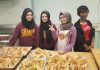 In 2024, the New Canadians Centre is celebrating 45 years of supporting newcomers to the Peterborough and Northumberland areas, including helping them become leaders in the community. Pictured in 2018 are Noor, Rushen, Simav, and Aicha, four newcomer youth from Syria and the Ivory Coast who came together as a group to volunteer to make food for clients of the Warming Room, which became One City Peterborough. Acknowledging the support their families received in their times of need, the girls felt it important to pay it forward by helping others in need. (Photo courtesy of New Canadians Centre)