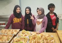 In 2024, the New Canadians Centre is celebrating 45 years of supporting newcomers to the Peterborough and Northumberland areas, including helping them become leaders in the community. Pictured in 2018 are Noor, Rushen, Simav, and Aicha, four newcomer youth from Syria and the Ivory Coast who came together as a group to volunteer to make food for clients of the Warming Room, which became One City Peterborough. Acknowledging the support their families received in their times of need, the girls felt it important to pay it forward by helping others in need. (Photo courtesy of New Canadians Centre)