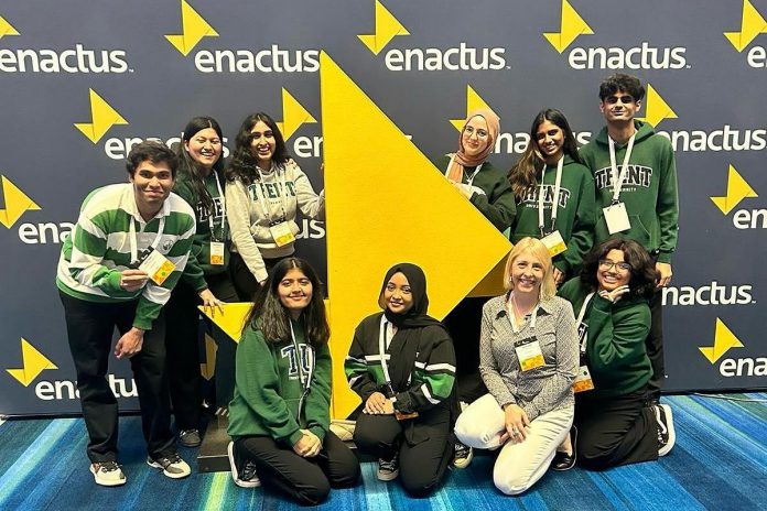 A newer team, Enactus Trent University competed in the Enactus Canada National Exposition for the second year in a row to share their project which preserves turns orange and other fruit peels into organic products. Melanie Buddle (front row, second from right) is the faculty advisor for Enactus Trent University. (Photo courtesy of Melanie Buddle)