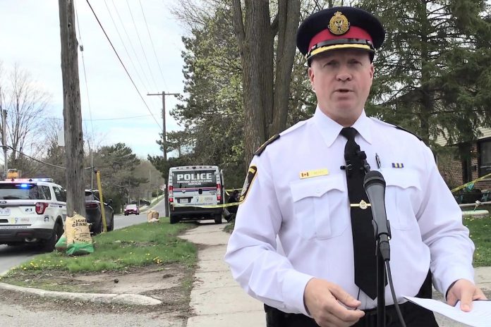 Peterborough police chief Stuart Betts held a media conference at 850 Fairbairn Street on May 1, 2024, to provide an update on a shooting the previous evening. The shooting victim, who is currently in hospital, and the three people facing charges were known to one another, were all involved in a housing unit takeover, and are not from Peterborough. (kawarthaNOW screenshot of Peterborough Police Service video)