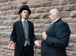 Lucas Pronk (left) as the 19th-century Upper Canada politician Peter Robinson with Nathan Govier as wealthy English landowner Lord Kingston. In a scene from Trent Valley Archives Theatre's play "Tide of Hope" being staged at at Market Hall Performing Arts Centre in Peterborough on May 15 and 16, 2024, Lord Kingston tries to impress Robinson by explaining his woes in feeding so many poor Irish families while rounding up Irish rebels, and finally attempts to convince Robinson to take them all off his hands by settling them in Upper Canada. (Photo: Suzanne Schroeter)