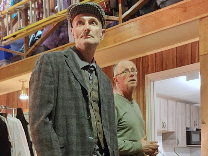 Director Gerry McBride (right) watches actor Paul Baines in the role of Patrick at the costume fitting for "Tide of Hope", the inaugural production from the Trent Valley Archives Theatre being staged at Market Hall Performing Arts Centre in Peterborough on May 15 and 16, 2024. (Photo: Suzanne Schroeter)