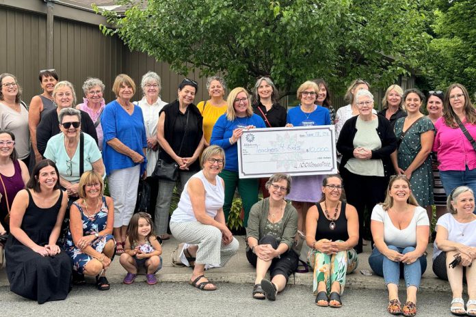 Kerrie Magnus and Janie Kelly of the Teachers for Kids Foundation with a cheque for $10,000, surrounded by members of the 100 Women Peterborough collective philanthropy group, who selected the charity to receive member donations at the group's meeting on June 18, 2024 at Ashburnham Funeral Home & Reception Centre in Peterborough. (Photo courtesy of 100 Women Peterborough)v