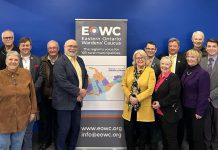 Some of the members of the Eastern Ontario Wardens' Caucus (EOWC) at a March 2024 meeting in Frontenac County, including (to the left and right of the banner) chair Renfrew County warden Peter Emon and vice-chair Peterborough County warden Bonnie Clark. (Photo: EOWC)