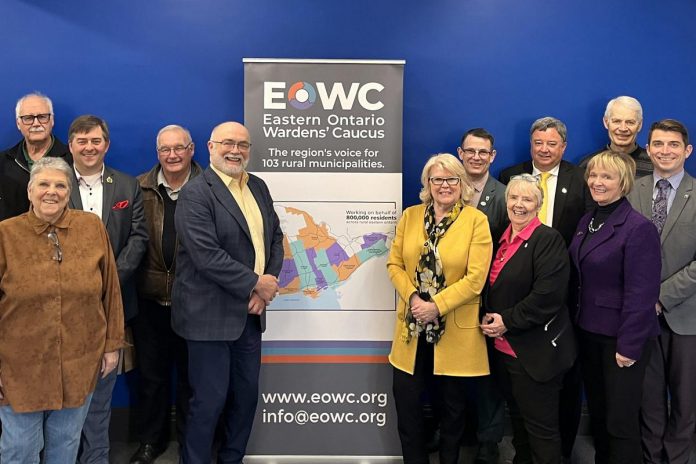 Some of the members of the Eastern Ontario Wardens' Caucus (EOWC) at a March 2024 meeting in Frontenac County, including (to the left and right of the banner) chair Renfrew County warden Peter Emon and vice-chair Peterborough County warden Bonnie Clark. (Photo: EOWC)