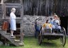 Jay (Rebecca Birrell, left) about to become a Farmerettes in a scene from 4th Line Theatre's "Onion Skins & Peach Fuzz: The Farmerettes" during a media day event on June 18, 2024 at the Winslow Farm in Millbrook. The world premiere of Alison Lawrence's play based on the 2019 book by Shirleyan English and Bonnie Sitter, which tells the little-known story of the young women who kept Canadian farms going during the Second World War, runs from July 1 to 20. (Photo: Jeannine Taylor / kawarthaNOW)