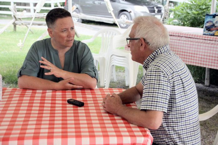 "Onion Skins & Peach Fuzz: The Farmerettes" director Autumn Smith speaks with kawarthaNOW writer Paul Rellinger during 4th Line Theatre's media day event on June 18, 2024 at the Winslow Farm in Millbrook. (Photo: Jeannine Taylor / kawarthaNOW)