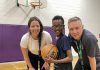 Five Counties Children's Centre recreation therapist Caitlin Ivany and Peterborough Youth Basketball Association diversity coordinator Joseph Hays pose with one of this spring's JumpBall participants. (Photo courtesy of Five Counties Children's Centre)