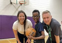 Five Counties Children's Centre recreation therapist Caitlin Ivany and Peterborough Youth Basketball Association diversity coordinator Joseph Hays pose with one of this spring's JumpBall participants. (Photo courtesy of Five Counties Children's Centre)