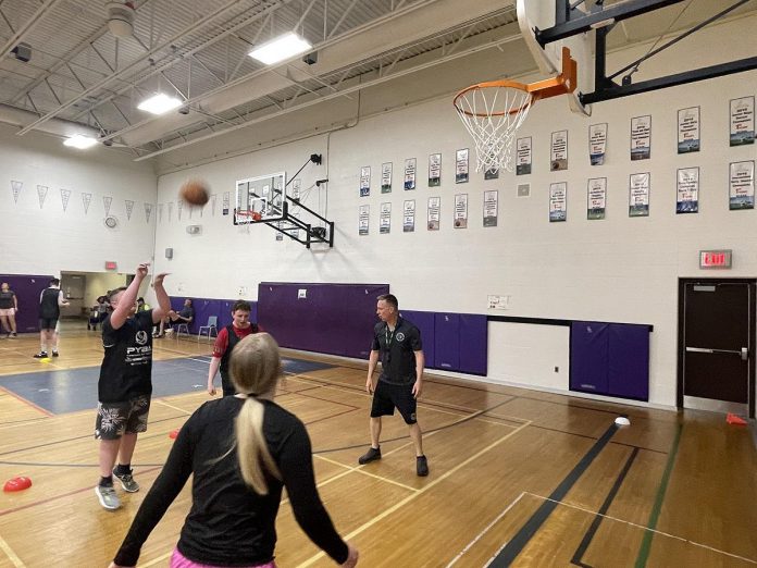 A JumpBall participant takes his best shot at the basket during a shoot-around session held this spring. JumpBall is a partnership between the Peterborough Youth Basketball Association and Five Counties Children's Centre and provides a basketball and game experience for kids with exceptionalities. (Photo courtesy of Five Counties Children's Centre)