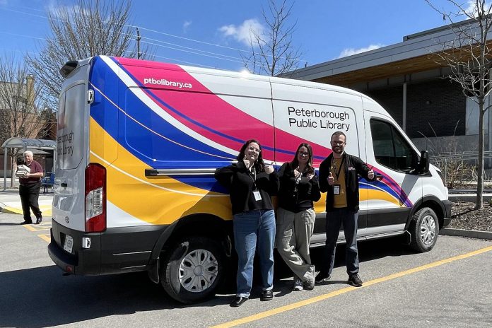 Jadyn Gay, Becky Waldman, and Mark Stewart of the Peterborough Public Library celebrate the library's new electric delivery van, the first fully electric vehicle in the City of Peterborough's fleet. The library will use the van for outreach events and to move materials between library kiosk locations and the new library branch opening at the Miskin Law Community Complex at Morrow Park. (Photo: City of Peterborough)