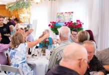 Attendees at Habitat for Humanity Peterborough & Kawartha Region's garden party fundraiser on June 1, 2024 raise their glasses during the event, which netted $21,500 for affordable home building projects in the area, including a planned new multi-unit condominium to be located on Lansdowne Street West in Peterborough. (Photo courtesy Habitat for Humanity PKR)