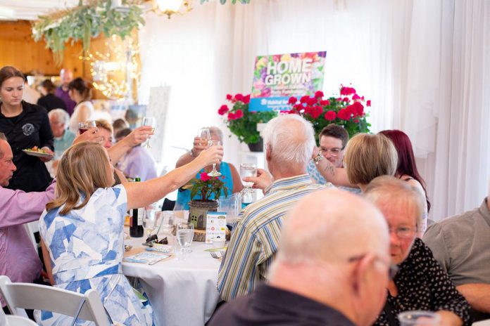 Attendees at Habitat for Humanity Peterborough & Kawartha Region's garden party fundraiser on June 1, 2024 raise their glasses during the event, which netted $21,500 for affordable home building projects in the area, including a planned new multi-unit condominium to be located on Lansdowne Street West in Peterborough. (Photo courtesy Habitat for Humanity PKR)