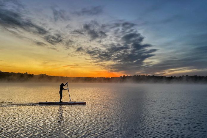 The Haliburton Highlands is an ideal destination for stand-up paddleboarders, as it has small and unconnected that offer calm and accessible waters. (Photo courtesy of Haliburton Highlands Economic Development & Tourism)
