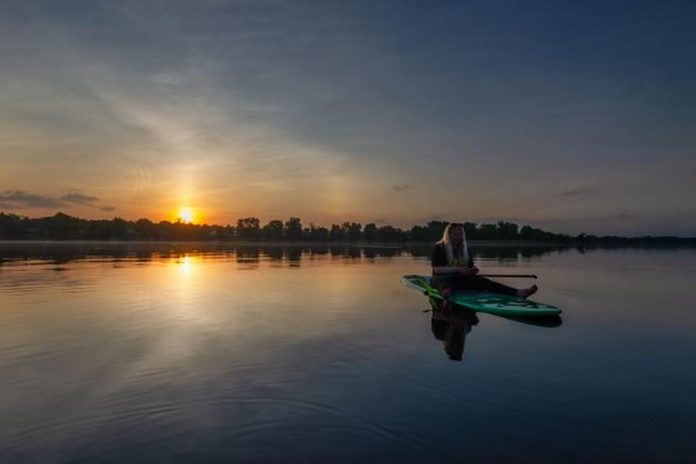 Inspiration always strikes Erin Shannon-Hill while she's on the water on her paddleboard on Chemong Lake. After living day-by-day to navigate her MS diagnosis for the past 10 years, the Ennismore entrepreneur is now taking the future into her own hands with the launch of Kawartha Apparel, a quality clothing brand inspired by the place she has loved and appreciated since she was a teenager. (Photo: Linda Kassil / Kawartha Kaptures Photography)