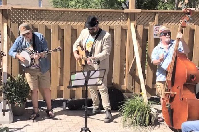 Elmhirst's Resort in Keene kicks off its Tuned Up Tuesdays summer concert series with bluegrass and southern folk band The Boogie Time Ramblers (Adam Gryck, Buster Fewings, Diamond Dave Russell) performing in the Wild Blue Yonder Pub on Tuesday evening. (Photo: Caitlin Smith)