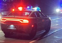 A Peterborough police car with light flashing at night. (Photo: Peterborough Police Service)