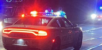 A Peterborough police car with light flashing at night. (Photo: Peterborough Police Service)