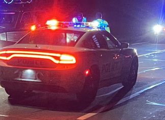 A Peterborough police car with lights flashing at night. (Photo: Peterborough Police Service)