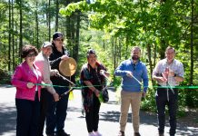 A ribbon-cutting ceremony for the Porcupine Universal Trail, the third accessible trail in the Northumberland County Forest, was held on May 31, 2024. Pictured from left to right are Northumberland County's CAO Jennifer Moore and natural heritage manager Todd Farrell, Alderville First Nation's cultural advisor Aiden Gorveatt and community engagement planner Jennifer Niles, Northumberland-Peterborough South MPP David Piccini, and Northumberland County Warden Brian Ostrander. (Photo: Northumberland County)