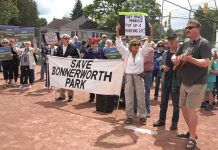 More than 250 people attended a 'Save Bonnerworth Park' rally on May 18, 2024 at the park at McDonnel Street and Monaghan Road where the City of Peterborough plans to build 16 pickleball courts. (kawarthaNOW screenshot of Mark Wollard video)