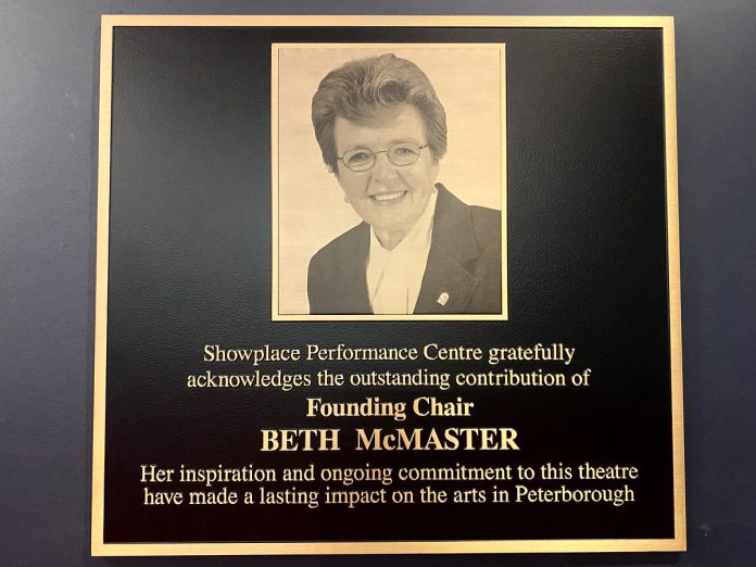 A plaque honouring Showplace Performance Centre's founding chair Beth McMaster was unveiled in the lobby of the performing arts venue during a celebration on June 11, 2024. McMaster was part of a group that helped open Showplace in 1996 and she served as the founding chair of the non-profit organization's board of directors. (Photo: Paul Rellinger / kawarthaNOW)