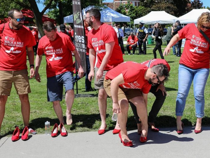 A signature (but optional) feature of YWCA Peterborough Haliburton's "Walk a Mile in Their Shoes" event sees participants (including men) literally walking a mile in women's shoes, both raising funds for the non-profit organization's services and programs and awareness of the ongoing epidemic of gender-based violence. (Photo courtesy of YWCA Peterborough Haliburton)