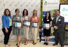 Five Counties Children's Centre board chair Julie Davis (far left) and Centre CEO Scott Pepin (far right) with four of the seven High-Five Community Recognition Awards recipients at the non-profit organization's annual meeting in late June 2024. Five Counties presents the awards each year to deserving individuals and groups that support and share the agency's vision of inclusion. (Photo: Five Counties Children's Centre)