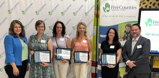 Five Counties Children's Centre board chair Julie Davis (far left) and Centre CEO Scott Pepin (far right) with four of the seven High-Five Community Recognition Awards recipients at the non-profit organization's annual meeting in late June 2024. Five Counties presents the awards each year to deserving individuals and groups that support and share the agency's vision of inclusion. (Photo: Five Counties Children's Centre)