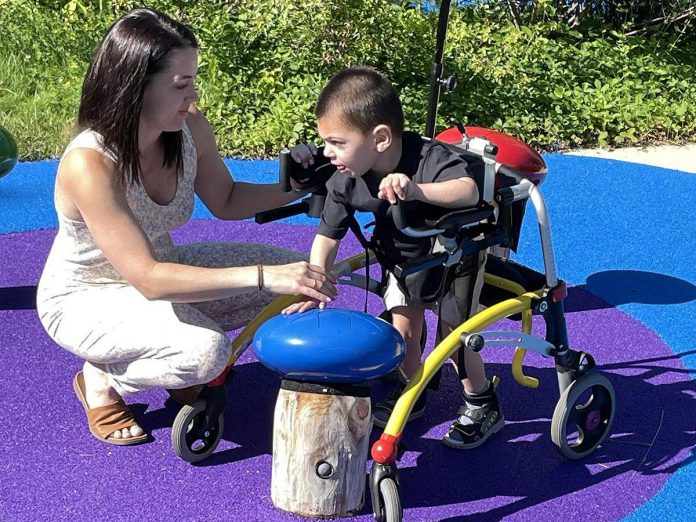 Julie Grant, pictured with her son Jude, was honoured by Five Counties Children's Centre with a High-Five Community Recognition Award for her extensive efforts to advocate for accessible playgrounds so that all kids can enjoy the benefits of play. (Photo: Five Counties Children's Centre)