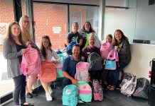 Gauvreau Accounting Tax Law Advisory founder and CEO Robert Gauvreau (front middle) pictured during 2023's Gear Up for Good" campaign, which helps ensure local children in need have backpacks and other school essentials in the fall. The third annual campaign is collecting donations until August 16 and the supplies will be distributed to on August 23. (Photo: Gauvreau Accounting Tax Law Advisory / Facebook)