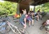 Participants in Peterborough GreenUP's new Urban Bike Adventures Camp take a well-deserved rest at Nicholls Oval Pavilion. Throughout the week, riders get more and more comfortable in the saddle with group rides, travelling to destinations including Ecology Park, Beavermead Park, Riverview Park & Zoo, and Jackson Park. (Photo: Natalie Stephenson / GreenUP)