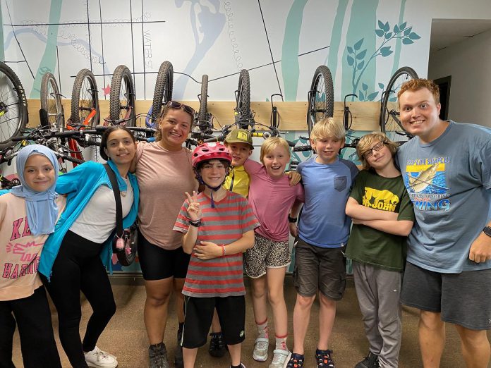 Campers during week three at Urban Bike Adventures Camp, along with cycling dducators Alyssa Hagley and Maxim Tandon. (Photo: Natalie Stephenson / GreenUP)