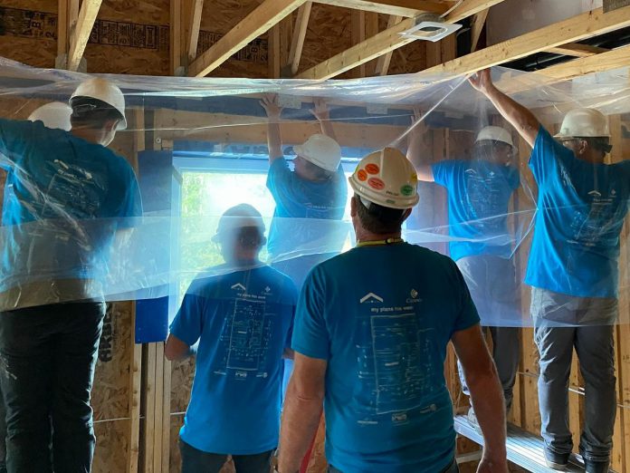 Employees at Rusco Windows & Doors in Cobourg helped Habitat for Humanity Northumberland at its multi-unit housing build in Baltimore by completing the interior vapour barrier, cutting bottom plates, and moving stairwells to prepare for drywall installation. (Photo: Habitat for Humanity Northumberland / Facebook)