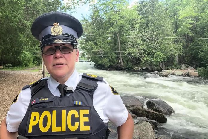 Sergeant Natalie Majer of the Haliburton Highlands Ontario Provincial Police (OPP) at Minden Wild Water Preserve where a woman was rescued on July 4, 2024 after falling into the water and being swept away by the current. (kawarthaNOW screenshot of OPP video)