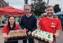 New Canadians Centre executive director Andy Cragg (centre) with team members during the non-profit organization's 45th anniversary block party outside its offices in Peterborough on June 28, 2024. The organization exceeded its 45th anniversary fundraising campaign goal of raising $45,000 and, as a result of an anonymous donor matching the amount raised up to $45,000, the campaign has actually netted $93,507. (Photo: New Canadians Centre / Facebook)