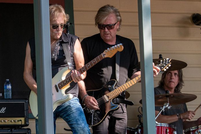 Derry Grehan, Johnnie Dee, and Dave Betts of Honeymoon Suite perform at the 2022 Wanakuen Concert at Bruce and Susan Hodges' Stoney Lake property. (Photo: Andrew Clowater)