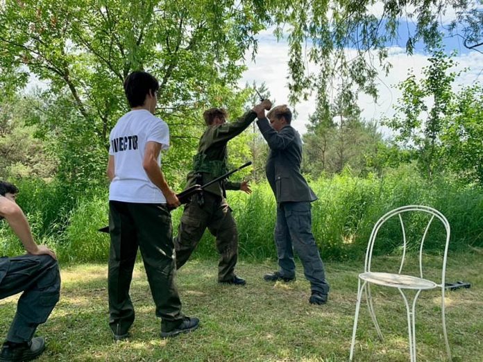 Kayden Carlton directs a fight scene for his short film "Behind The Lines" that premieres on August 23, 2024 at Market Hall Performing Arts Centre in downtown Peterborough. The Bethany filmmaker was just 16 years old when he directed the film that was shot four days of filming spread over a month in 2022. (Photo courtesy of Kayden Carlton)