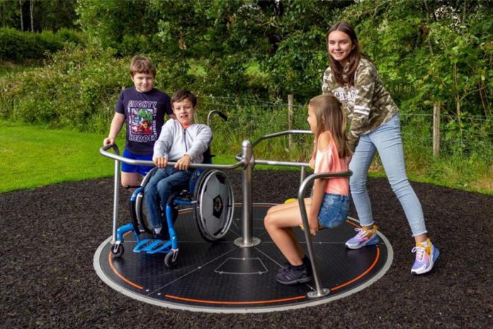 One element of the inclusive playground would be an "orbit": an accessible merry-go-round that sits seamlessly at ground level to offer children a spinning experience without having to leave their mobility device. (Photo: Playdale Playgrounds)