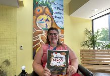 Hayley Hodges, client and family engagement lead at Five Counties Children's Centre, displays a poster for "Ready for School 101" sessions the children's treatment centre is hosting in August for children with disabilities or exceptionalities who are heading to school for the first time and their families. The sessions take place at Five Counties sites in Peterborough (Aug. 20), Cobourg (Aug. 21) and Lindsay (Aug. 22). (Photo: Five Counties)