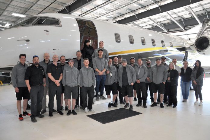 Employees at Flying Colours Corp. celebrating National Aviation Maintenance Technician Day on May 24, 2024. The company began as a family business and that family culture continues today, with the Flying Colours team helping to develop the company's reputation for high-quality work, an innovative spirit, and a strong collaborative culture. (Photo: Flying Colours Corp.)